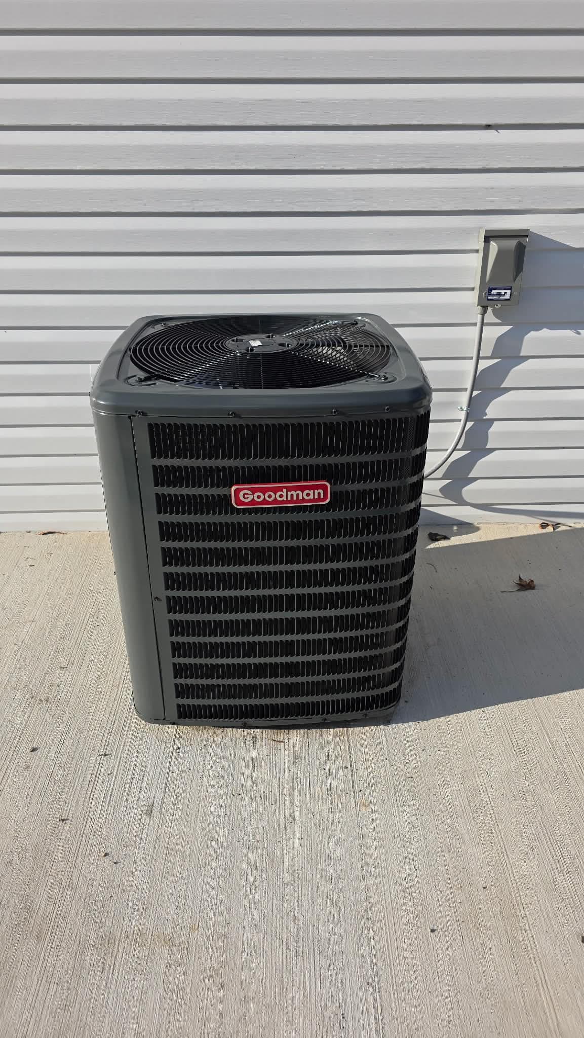 Outdoor HVAC condenser unit installed by Jarrell's Quality